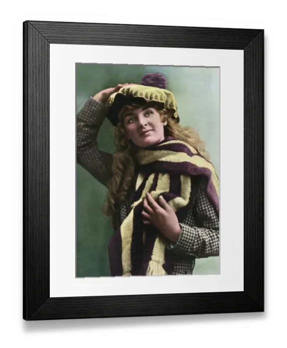 Framed Print : A woman in a purple and yellow hat, and matching scarf Framed Print : A woman in a purple and yellow hat, and matching scarf