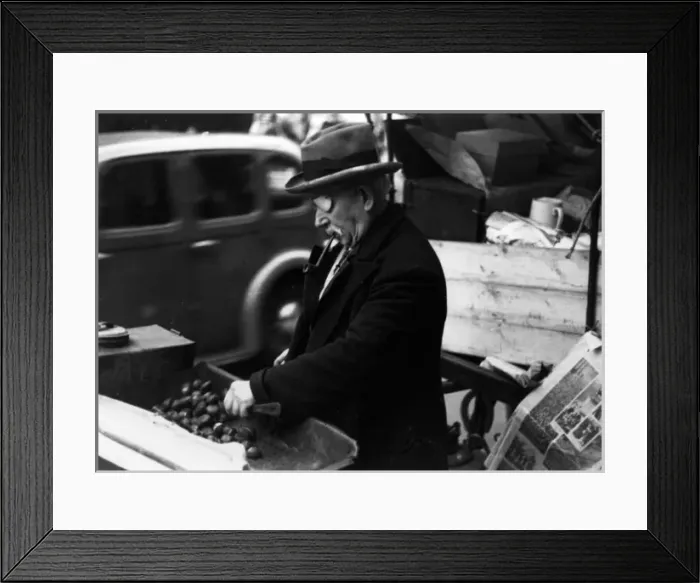 Framed Print : One-eyed man roasting chestnuts at market Framed Print : One-eyed man roasting chestnuts at market