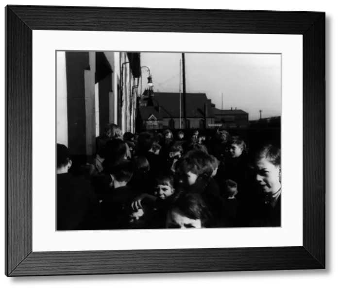 Framed Print : Children waiting outside cinema Framed Print : Children waiting outside cinema