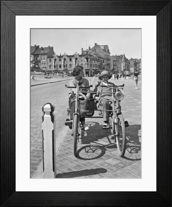 Framed Print : Young woman and boy on two-seater cycle, Bruges, Belgium Framed Print : Young woman and boy on two-seater cycle, Bruges, Belgium