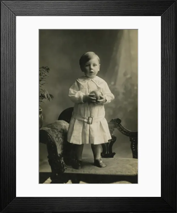 Framed Print : Small boy standing on chaise-longue Framed Print : Small boy standing on chaise-longue