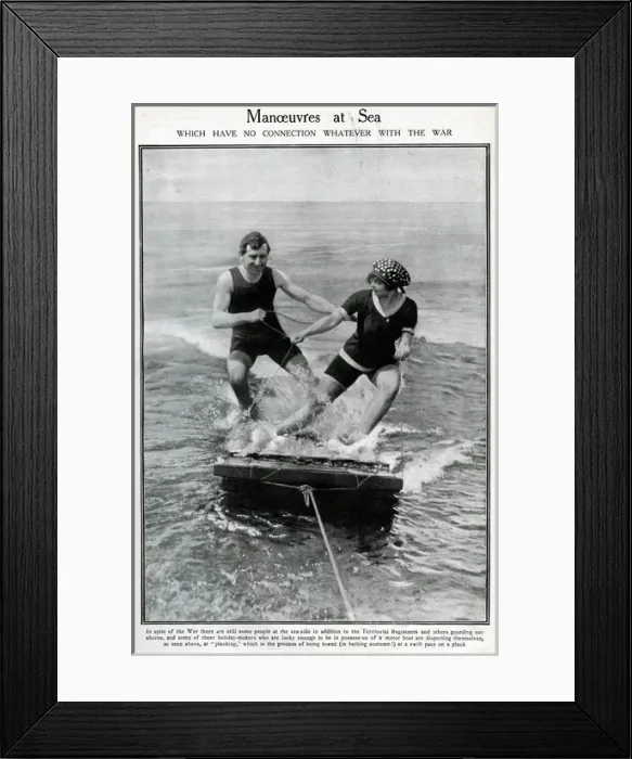 Framed Print : Couple water-planing on a wooden raft Framed Print : Couple water-planing on a wooden raft