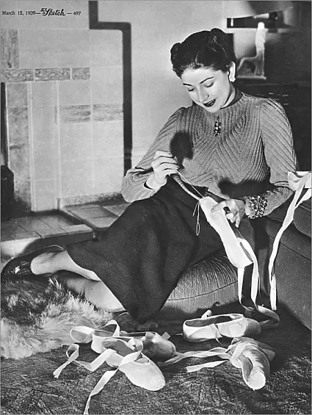 Margot Fonteyn repairing her ballet shoes