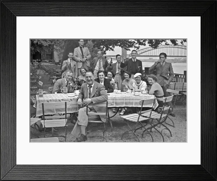 Framed Print : People sitting at a table in the open air Framed Print : People sitting at a table in the open air