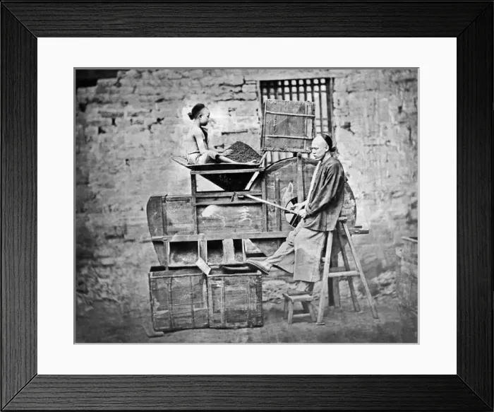 Framed Print : Man and boy sifting tea, China Framed Print : Man and boy sifting tea, China