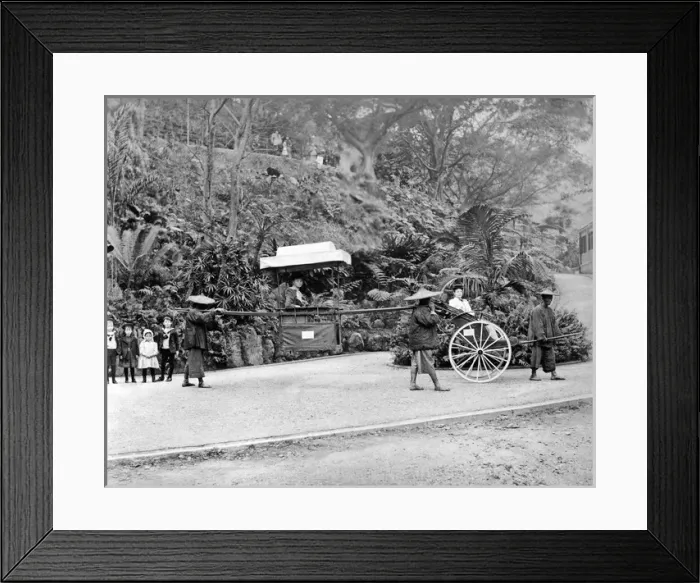 Framed Print : Western woman in carrying chair, Hong Kong, China Framed Print : Western woman in carrying chair, Hong Kong, China
