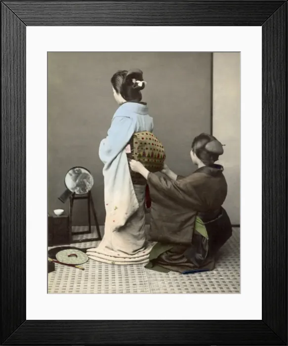 Framed Print : Adjusting an obi sash, Japan Framed Print : Adjusting an obi sash, Japan