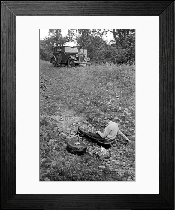 Framed Print : Man in a field with parked car Framed Print : Man in a field with parked car