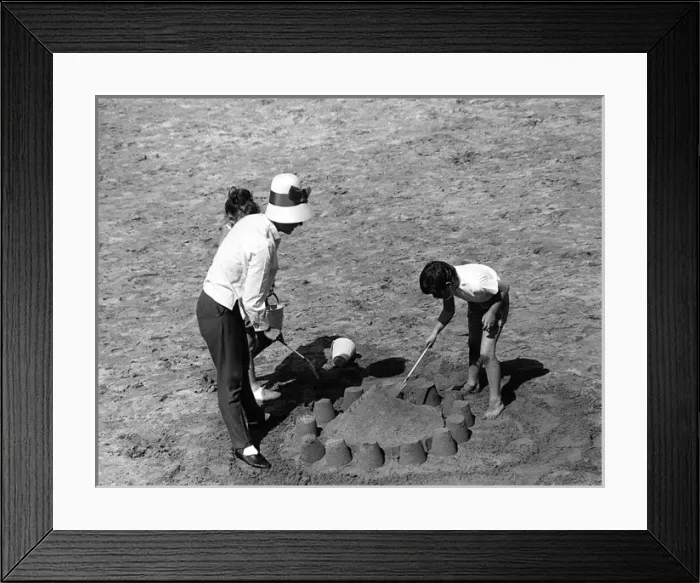 Framed Print : Mother and children making sandcastle Framed Print : Mother and children making sandcastle
