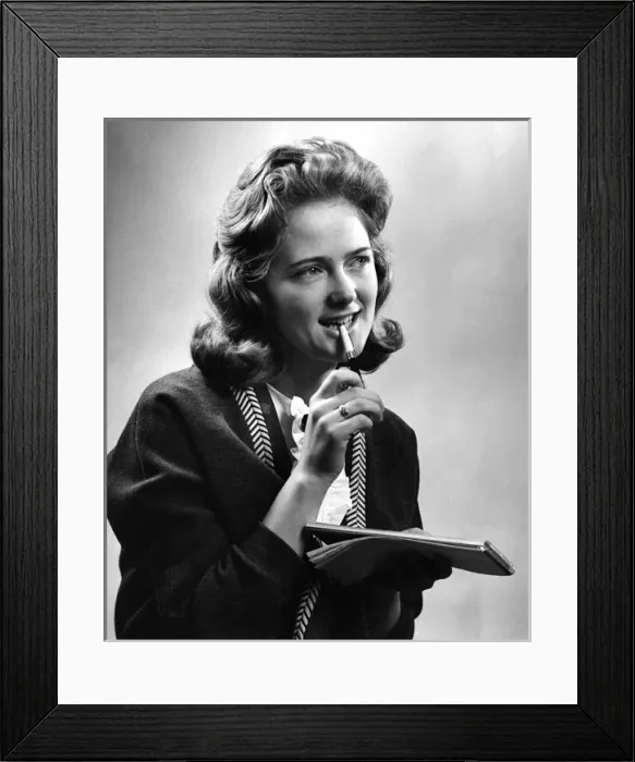 Framed Print : Young woman with notebook and pen Framed Print : Young woman with notebook and pen