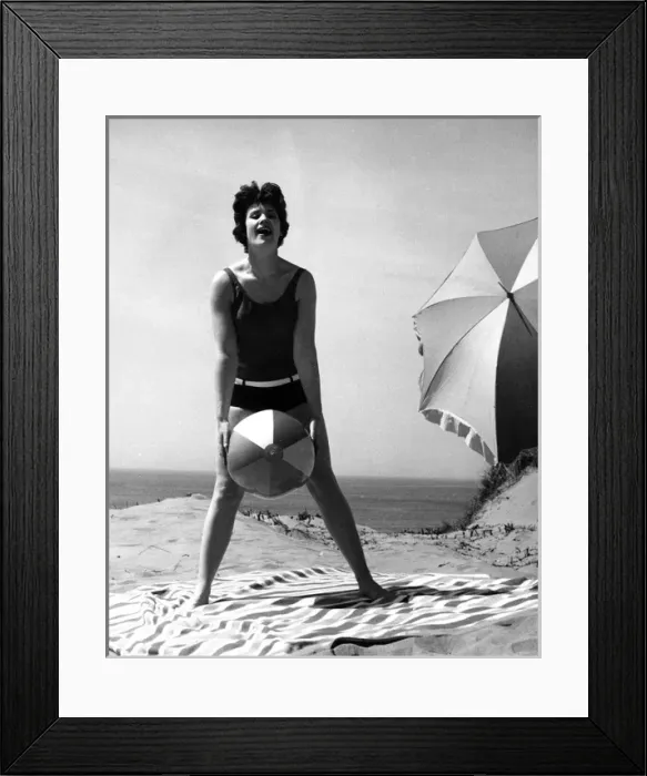 Framed Print : Woman on beach with ball and sunshade Framed Print : Woman on beach with ball and sunshade