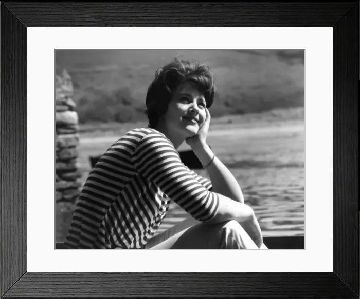 Framed Print : Woman relaxing in stripy top Framed Print : Woman relaxing in stripy top