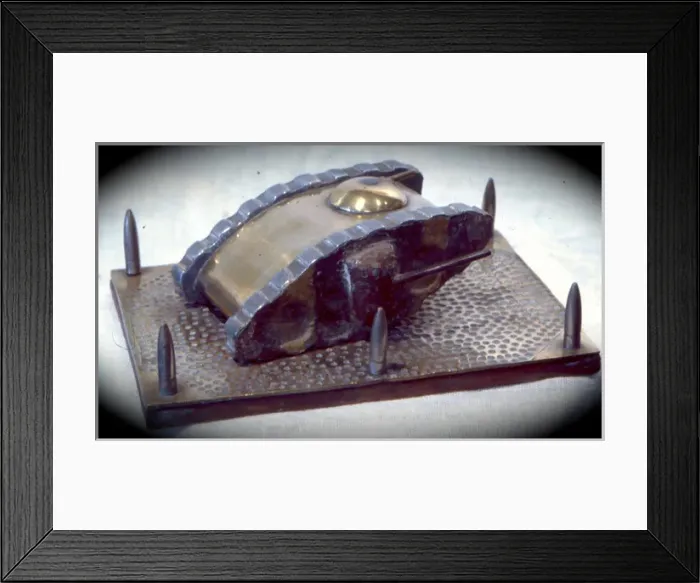 Framed Print : WW1 tank, camouflaged sides on beaten brass base Framed Print : WW1 tank, camouflaged sides on beaten brass base