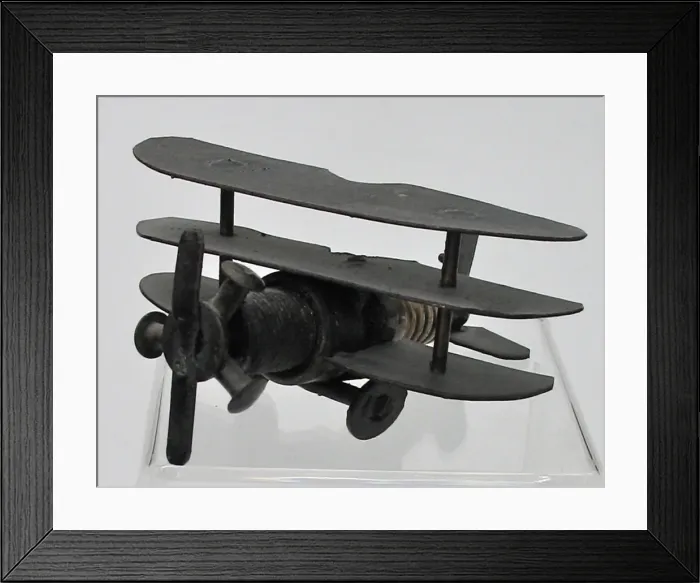 Framed Print : Trench Art triplane - a sparkplug fuselage and metal wings Framed Print : Trench Art triplane - a sparkplug fuselage and metal wings