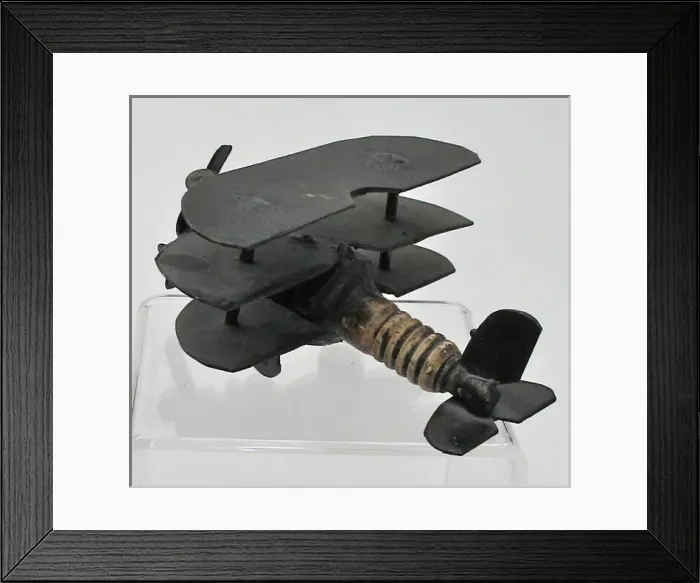 Framed Print : Trench Art triplane - a sparkplug fuselage and metal wings Framed Print : Trench Art triplane - a sparkplug fuselage and metal wings