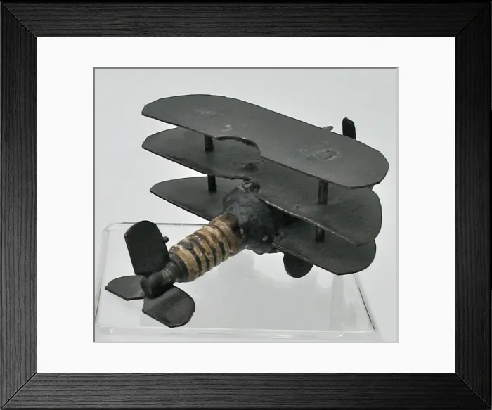 Framed Print : Trench Art triplane - a sparkplug fuselage and metal wings Framed Print : Trench Art triplane - a sparkplug fuselage and metal wings