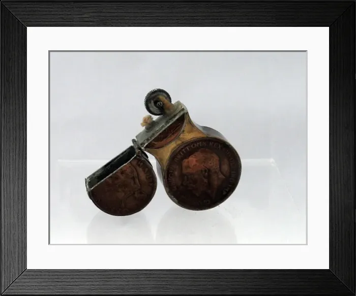 Framed Print : Trench Art lighter in the shape of the number eight Framed Print : Trench Art lighter in the shape of the number eight