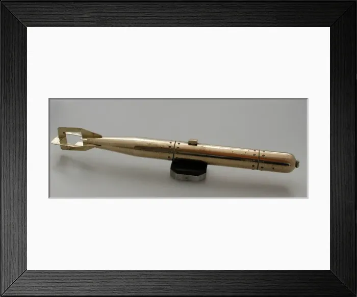 Framed Print : Brass model of torpedo sitting on bakelite and metal stand Framed Print : Brass model of torpedo sitting on bakelite and metal stand