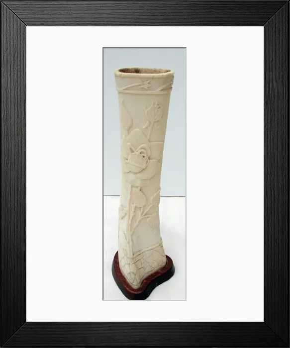 Framed Print : Pair of carved bone ornaments with raised foliate decoration Framed Print : Pair of carved bone ornaments with raised foliate decoration
