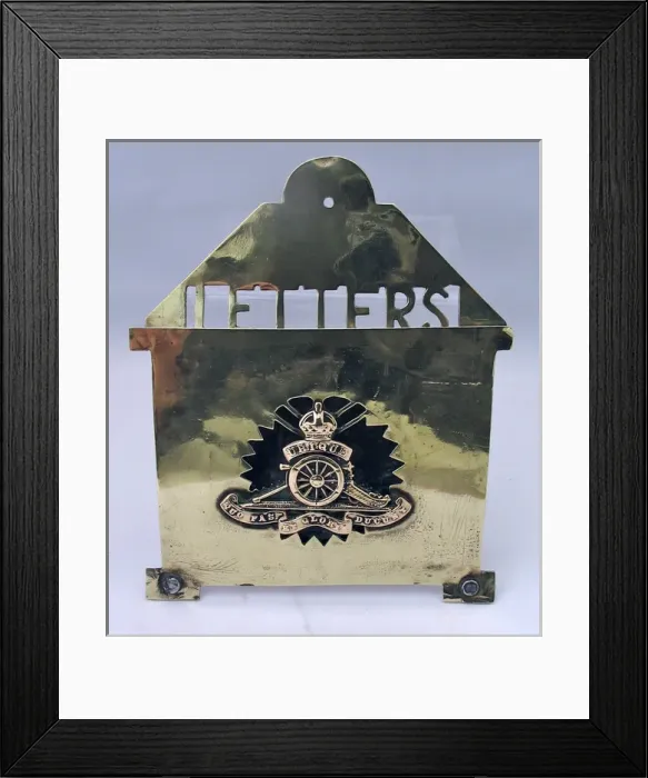 Framed Print : Brass letter rack with badge of the Royal Artillery Framed Print : Brass letter rack with badge of the Royal Artillery