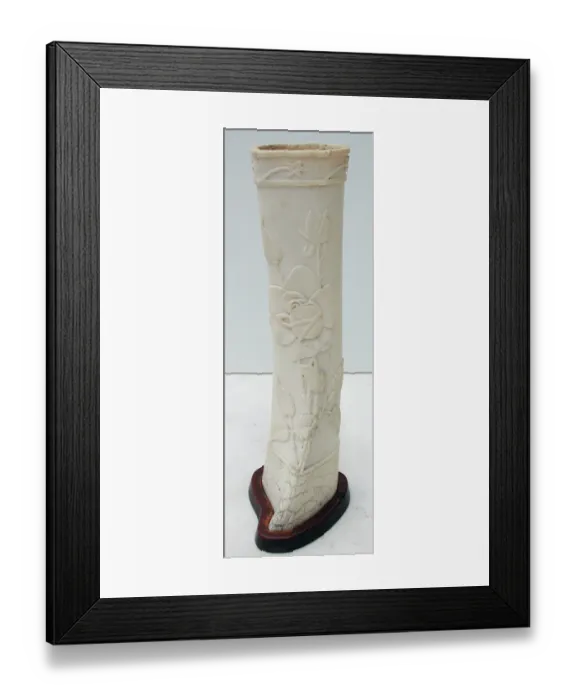 Framed Print : Pair of carved bone ornaments with raised foliate decoration Framed Print : Pair of carved bone ornaments with raised foliate decoration