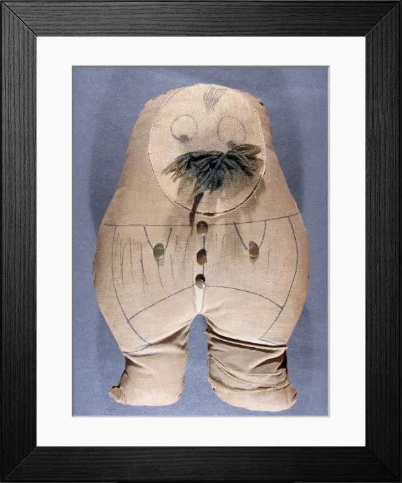 Framed Print : Ole Bill printed fabric doll with wood and button detail Framed Print : Ole Bill printed fabric doll with wood and button detail