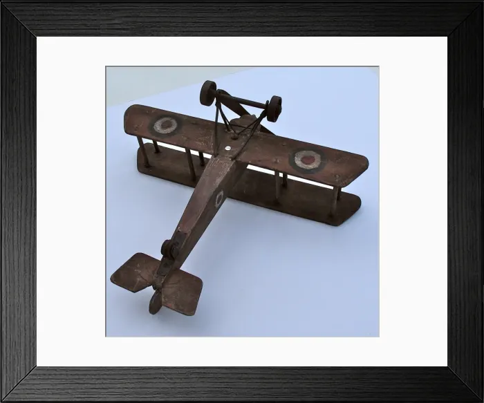 Framed Print : A hand-made wooden model of a WWI biplane Framed Print : A hand-made wooden model of a WWI biplane