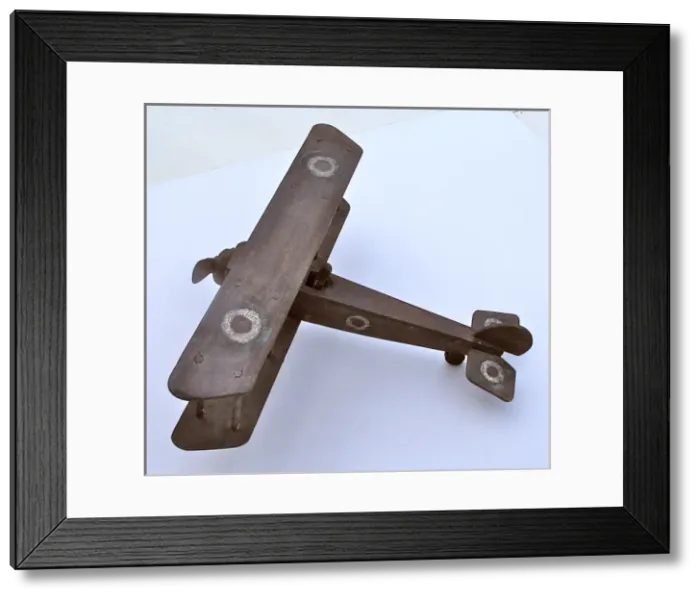 Framed Print : A hand-made wooden model of a WWI biplane Framed Print : A hand-made wooden model of a WWI biplane