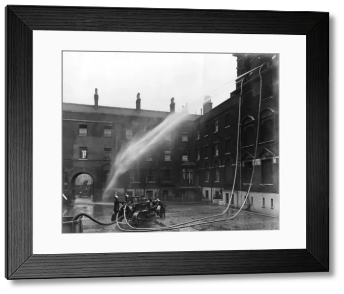 Framed Print : LCC-London Fire Brigade, motorised pump at hose drill Framed Print : LCC-London Fire Brigade, motorised pump at hose drill
