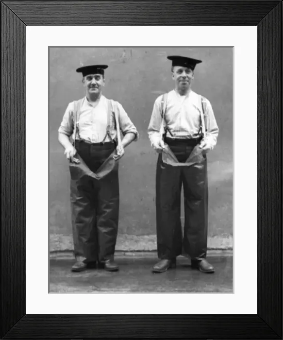 Framed Print : Two firemen modelling waterproof leggings Framed Print : Two firemen modelling waterproof leggings