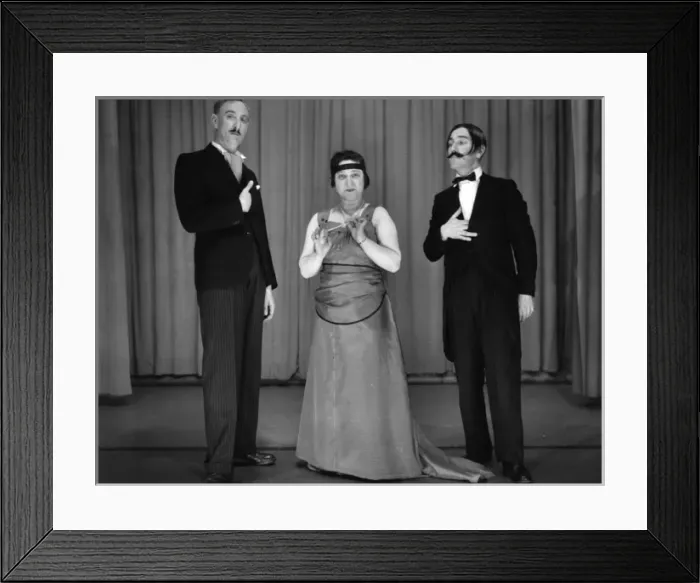 Framed Print : Two men and a woman performing in a comic sketch Framed Print : Two men and a woman performing in a comic sketch
