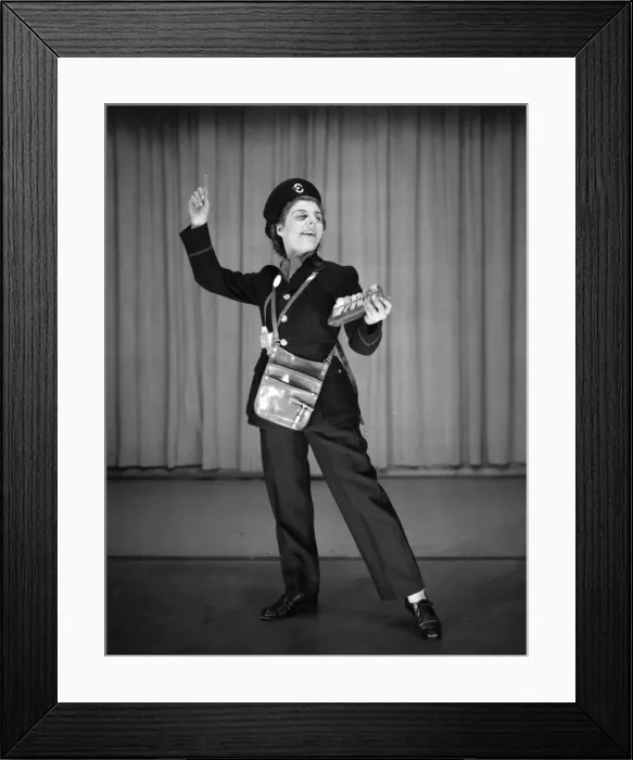 Framed Print : Woman performing as a bus conductor in a comic sketch Framed Print : Woman performing as a bus conductor in a comic sketch