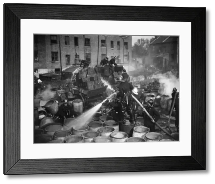 Framed Print : Firefighters in action, Calders Wharf, East London Framed Print : Firefighters in action, Calders Wharf, East London