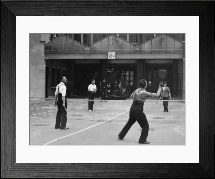Framed Print : Firefighters playing tennis during a break, London Framed Print : Firefighters playing tennis during a break, London
