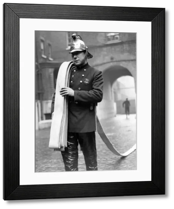 Framed Print : LFB firefighter, manual method of hose laying Framed Print : LFB firefighter, manual method of hose laying