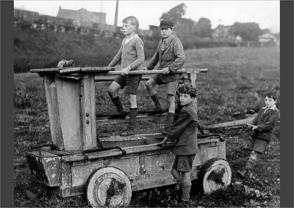 Boys on an 18th century fire engine, Wirksworth