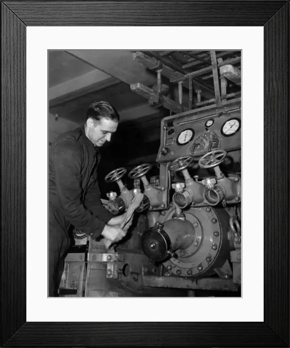 Framed Print : LFB firefighter cleaning an enclosed pump vehicle Framed Print : LFB firefighter cleaning an enclosed pump vehicle
