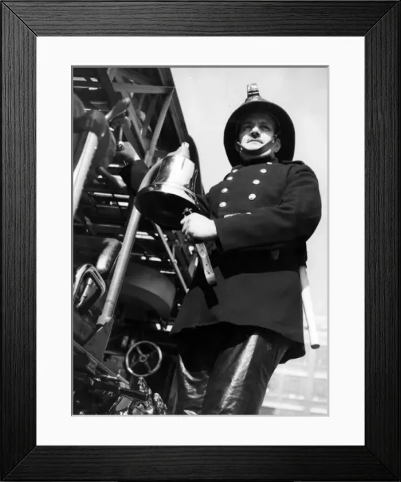 Framed Print : Firefighter adjusting turntable ladder mechanism Framed Print : Firefighter adjusting turntable ladder mechanism