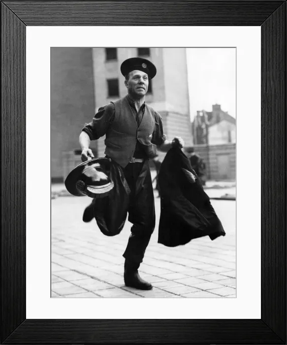 Framed Print : LFB firefighter in a hurry, with coat and helmet Framed Print : LFB firefighter in a hurry, with coat and helmet