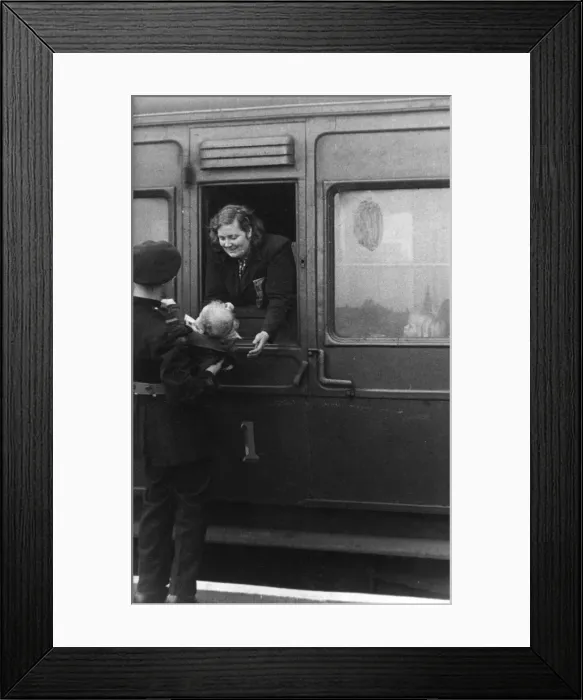 Framed Print : NFS firefighter helping evacuees, St Pancras, WW2 Framed Print : NFS firefighter helping evacuees, St Pancras, WW2