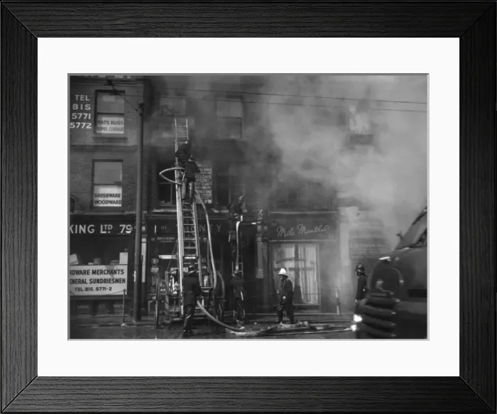 Framed Print : Firefighters in action in Commercial Road, East London Framed Print : Firefighters in action in Commercial Road, East London