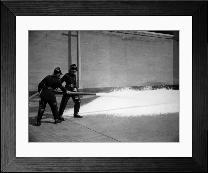 Framed Print : Firefighters training with foam extinguisher Framed Print : Firefighters training with foam extinguisher