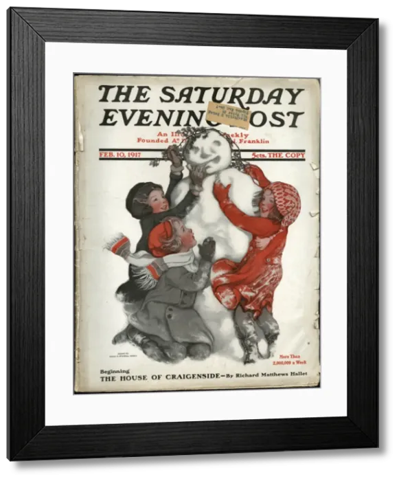 Framed Print : Three children completing their snowman Framed Print : Three children completing their snowman