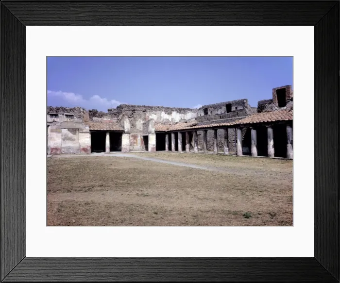 Framed Print : Pompeii. The shaded walkway of a roofed and collonnaded public space surrounding Framed Print : Pompeii. The shaded walkway of a roofed and collonnaded public space surrounding
