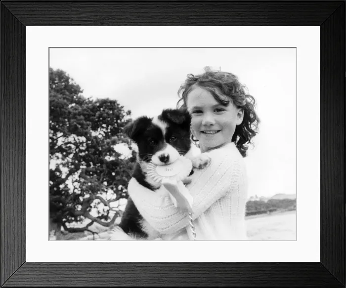 Framed Print : Young girl with Puppy Framed Print : Young girl with Puppy