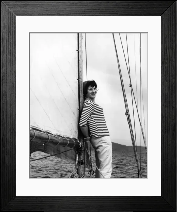 Framed Print : Girl in striped shirt leaning on the mast of a sailing boat Framed Print : Girl in striped shirt leaning on the mast of a sailing boat