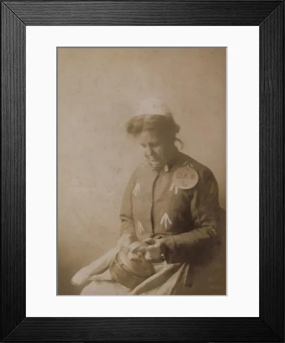 Framed Print : Suffragette in Prison Dress Cleaning Kettle Framed Print : Suffragette in Prison Dress Cleaning Kettle