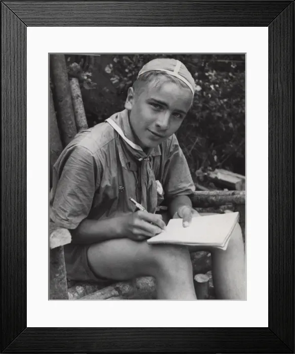 Framed Print : Finnish boy scout writing in a notebook Framed Print : Finnish boy scout writing in a notebook
