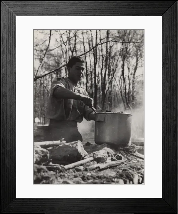 Framed Print : French boy scout cooking at camp Framed Print : French boy scout cooking at camp