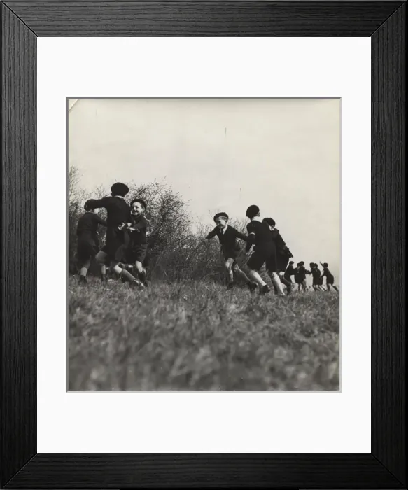 Framed Print : French cub scouts playing in a field
